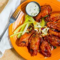Wings · Gluten Free. Your choice of lemon and herb, medium, hot, or hot honey buffalo served on a be...