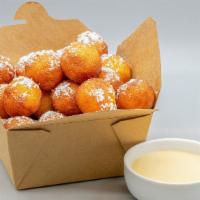 Donut Holes · 12 Warm and yummy vanilla cake donut holes, dusted with powdered sugar. Served with decadent...