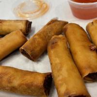 Chicken Spring Roll/Lumpia (10 Pcs) · Traditional filipino spring roll with carrots, scallions and celery served with sweet chili ...