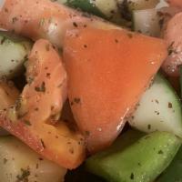 Fattoush Salad · Tomato, cucumber, onion, bell peppers, toasted pita bread and spices tossed in olive oil and...