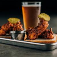 Nashville Hot Chicken Tenders · We use hand breaded tenders for our spin on this classic dish. Just enough heat to keep you ...