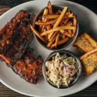 Whole Rack Baby Back Ribs · Our baby backs are dusted with a house-made dry rub then slow cooked before finishing on an ...