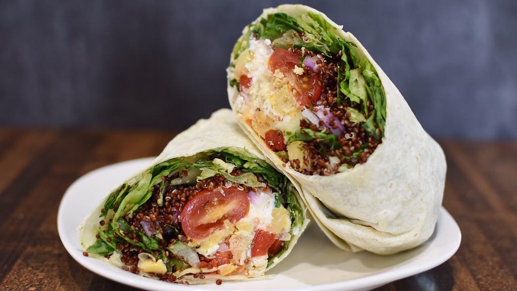 Santorini Wrap · Chopped romaine, red onion, crumbled feta, quinoa, chickpeas, red peppers, grape tomatoes, cucumbers, and pita chips with lemon juice and olive oil in your choice of wrap.