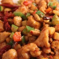 Sweet & Sour Chicken · Crisp-fried chicken cooked with pineapples, chopped onions, and bell peppers served with a s...