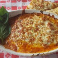 Martha'S Lasagna · Layers of pasta with cheese and meat sauce topped with  mozzarella, served with garlic bread...