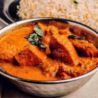 Chicken Tikka Masala · Boneless white meat chicken cooked with tomatoes & herb sauce