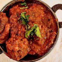 Lamb Achari · Lamb cooked with spicy pickles.