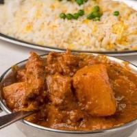 Beef Vindaloo · Succulent beef cooked with potatoes in a tangy, highly spiced sauce.