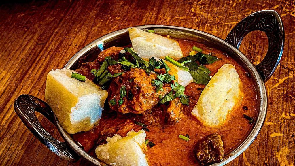 Beef Aloo  · Beef cubes cooked with potatoes and mild spices.