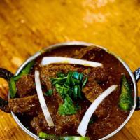 Beef Kadhai · Beef cooked with fresh tomatoes, onions, and peppers.