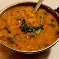 Dal Tarka · Yellow lentils cooked with onions and spices.
