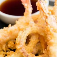 Shrimp Tempura · Lightly battered shrimp tempura served with a side of warm tempura sauce.