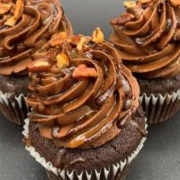 Turtle Cupcake · Chocolate cake filled with caramel Whip, topped with chocolate buttercream, Chocolate ganach...