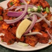 Paneer 65 · Paneer Cubes Marinated with South-Indian Spices, Sautéed  with Chopped Onions and Bell Peppers
