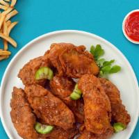 Hot Boneless Wings · Breaded boneless chicken breast chunks fried to perfection, tossed in our house made hot sau...