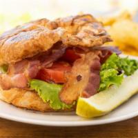 Blt Croissant · Served on a fresh baked croissant, with thick cut applewood smoked bacon, fresh lettuce, sli...