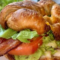 Bacon Turkey Cheddar Guac Croissant · Served on a fresh baked croissant, with thick cut applewood smoked bacon, turkey breast, fre...