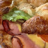 Black Forest Ham & Cheese Croissant · Served on a fresh baked croissant, with black forest ham, a mild Swiss cheese, thinly sliced...