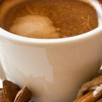 Dirty Chai Latte · Bold black tea with cardamom, cinnamon, ginger, vanilla, and star anise to deliver a robust,...