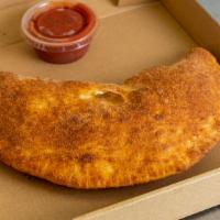 Large Calzone · Large Calzone is served wrapped in dough made daily at our shop.  Large Calzone is served wi...