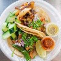 Tacos · With a choice of meat, cilantro, onions, lime.