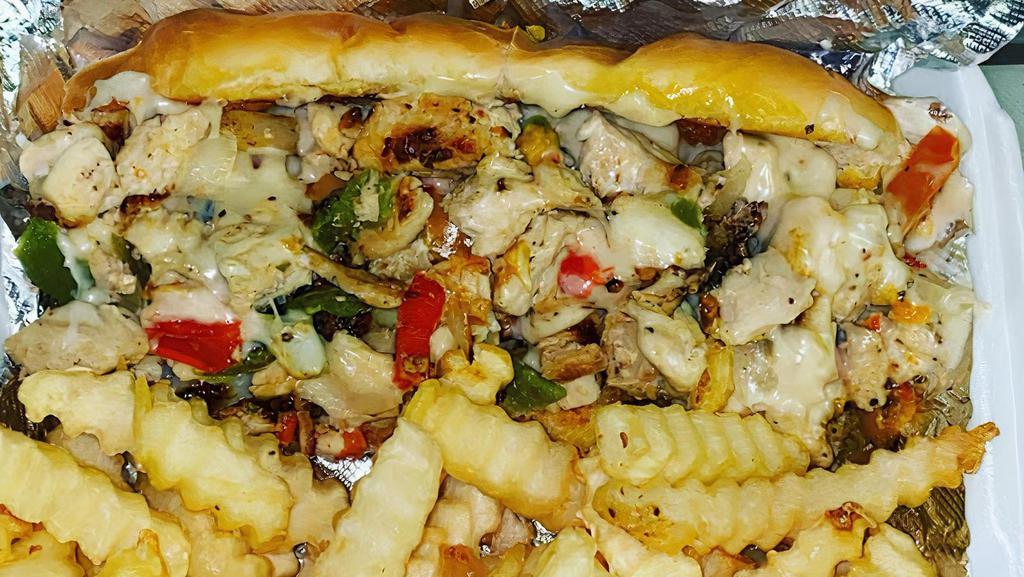 Philly Chicken Combo · Served with colorful sautéed peppers, onions, and 
cheese, jalapenos are optional, fries and drink included. 
(Add your favorite sauce for $.50).