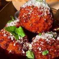 Crispy Mac & Cheese Balls · Crispy Mac & Cheese Balls topped with Cilantro and Cotija Cheese served with our House Made ...