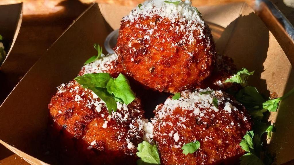 Crispy Mac & Cheese Balls · Crispy Mac & Cheese Balls topped with Cilantro and Cotija Cheese served with our House Made Horseradish Sauce.