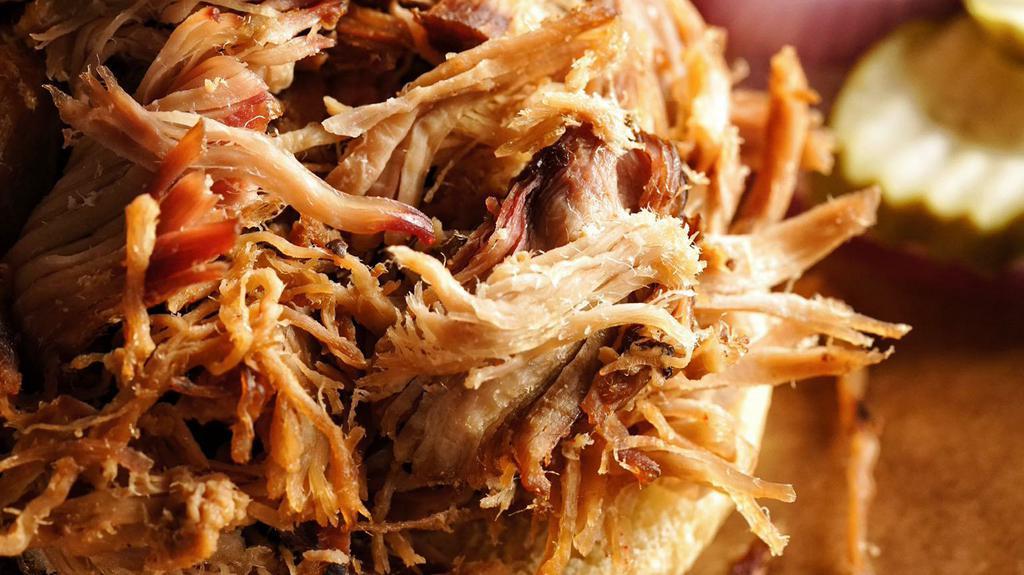 Family Meal Feeds 2-4 · Our Feast Family Meal feeds 2-4 and includes 1# of Our House Smoked Pulled Pork, Chopped Chicken, or Crispy Tofu (Brisket is just $4.95 more), A Pint Each of Two Different Sides, 4 Buns, and Barbecue Sauce on the side for the family.