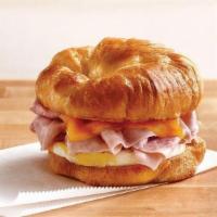 Sunshine Breakfast Croissant · Your choice of ham, bacon, sausage, or deli sliced turkey breast with melted cheddar cheese ...