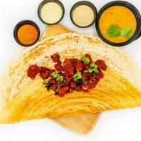 Chicken 65 Dosa · Fermented spicy crepe or rice cake made w/ rice & lentil batter, chicken 65 & served w/ samb...