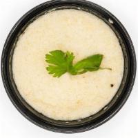 Coconut Chutney · Traditional South Indian condiment made by blending fresh coconut with chillies, cumin, ging...