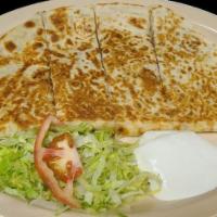 Quesadillas · meat and cheese with a side of lettuce, sour cream, and tomatoes