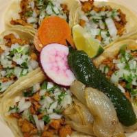 Tacos · corn tortilla, meat, onions, cilantro