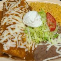  Burrito Plate · burrito topped with special sauce and cheese and a side of rice, beans, lettuce, tomatoes, a...