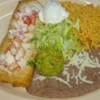 Chimichanga · fried flour tortilla with the meat of your choice, cheese and beans and a side of rice, bean...