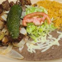 Pork Carnitas · fried pork cooked with onions and a side of rice, beans salad, and tortillas