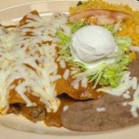 Enchiladas · corn tortilla stuffed with the meat of your choice covered in special sauce and melted chees...