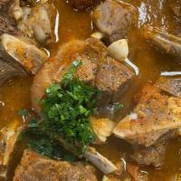 Goat Soup · A hearty soup cooked with goat meat, herbs, and spices.