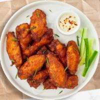Wings · Classic bone-in wings oven- baked, cooked to order perfectly crisp, and tossed with your cho...
