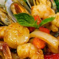 Bangkok Seafood Delight · Shrimp, scallops, squid, and mussels simmered in a Thai spicy basil sauce with onions, and r...