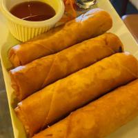 Golden Spring Rolls · Vegetarian. Crispy vegetable rolls are filled with celery, carrots, cabbage, and cellophane ...
