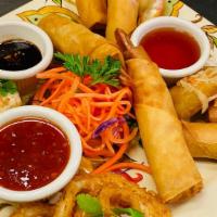 Kao Thai Sampler · Combination of 5 appetizers (Golden Spring Rolls, Crispy Crab Rolls, Steamed Dumpling, Shrim...