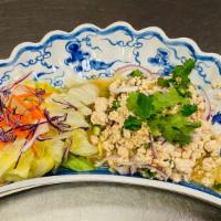 Larb Gai · Spicy chicken salad, Larb Gai is made with minced chicken tossed with lime juice, red onion,...