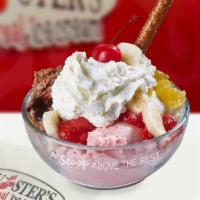 Banana Split · Vanilla, chocolate and strawberry ice cream topped with chocolate syrup, strawberries, pinea...