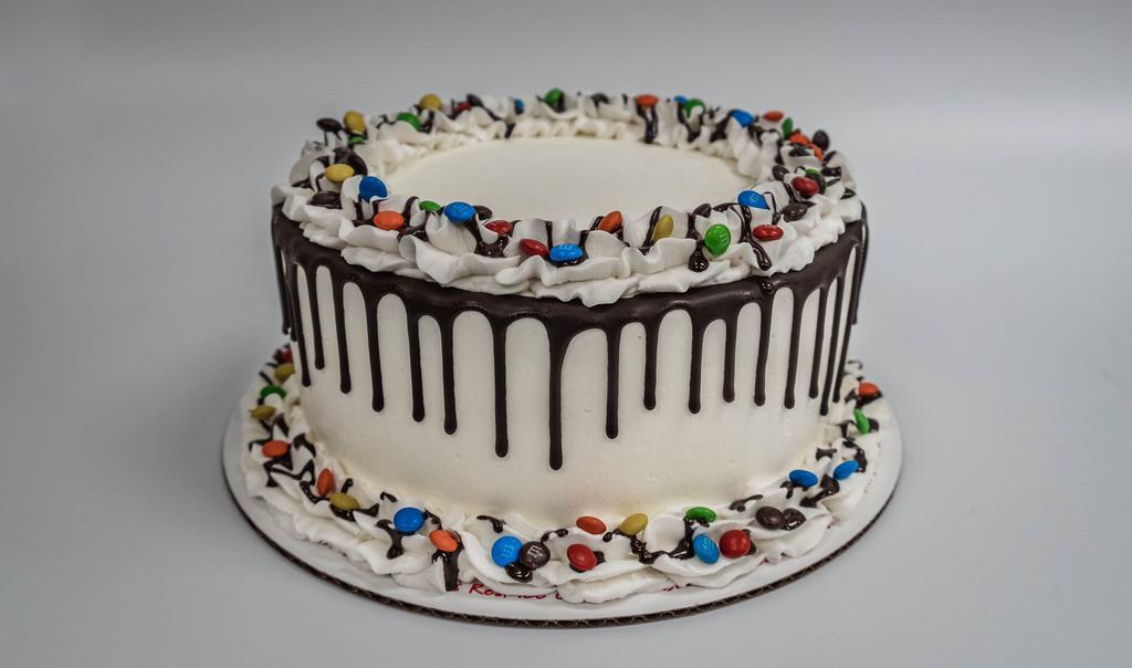 Cake- Vanilla Ice Cream, Chocolate Cake · Chocolate cake with vanilla ice cream with fudge filling. Chocolate drizzle decoration. 8 inch round cake.