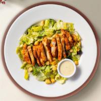 Chicken Caesar Salad · Grilled chicken with crispy romaine lettuce, Parmesan cheese and croutons.  Dressing on the ...