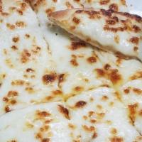 Cheesy Bread · Our Pizza dough, buttered & smothered in cheese, baked and then cut into strips and served w...
