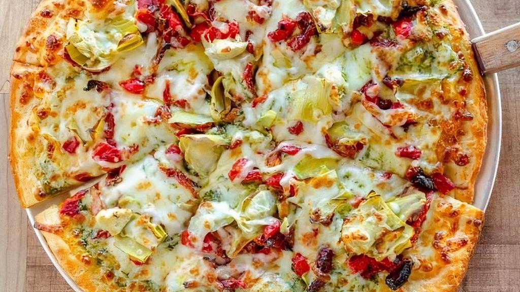 Green Island Pizza · Green pesto sauce with artichoke hearts, sun-dried tomatoes, roasted red peppers, and mozzarella cheese.