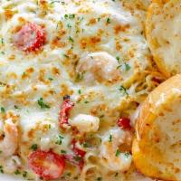 Spicy Garlic Shrimp Scampi Pasta · Shrimp, spaghetti, red onions, roasted red pepper, and sliced grape tomatoes baked in a butt...
